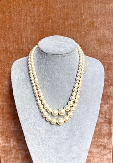 "Vintage Carolee multi strand pearl necklace. The strands measure 18\" and 20\". Signed on the clasp." Classic Multi-strand Pearl White Necklace, Classic Multi-strand Pearl White Necklaces, Classic Pearl White Multi-strand Necklaces, Formal Multi-strand Pearl Necklace With Charm, Formal Multi-strand Pearl Necklace, Classic Multi-strand Pearl Necklace, Classic Multi-strand Pearl Necklace With Charm, Pearl White Multi-strand Pearl Necklace, Elegant Double Strand Pearl Layered Necklace