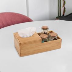 a wooden box with some food in it on a table