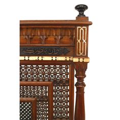 an ornate wooden cabinet with carved carvings on the front and sides, inlaid to wood