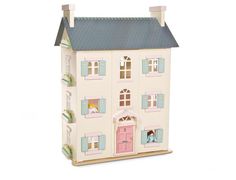 a toy doll house is shown with the door open and windows painted pink, blue and white