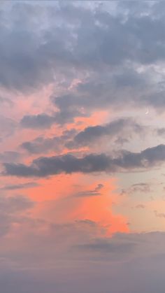 the sky is pink and blue with some clouds