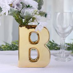 $7.99 | Add a touch of luxury to your decor with this gorgeous ceramic letter vase. It's crafted from high-quality ceramic and features a lustrous metallic gold finish that adds instant glamour to any space. The top opening makes it easy to insert flowers or other decorative items, and the alphabet design means you can spell out any word or phrase you like. Whether you use it as a centerpiece or as a fun way to personalize your home or event decor, this vase is sure to make a statement. Crystal Bowls, Vase Centerpieces, Keramik Vase