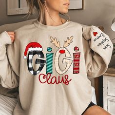 Link to add on a message card, gift card: https://www.etsy.com/listing/1462461713/godmerch-custom-gift-message-card Godmerch Gigi Claus Christmas Sweatshirt, Custom Gigi Claus And Kids, Grandma Gift Sweatshirt If you looking for a personalized t-shirt to show your love to your family, it's will be best choice. Our Classic T-Shirt serves as the perfect short-sleeved shirt for your unique, funny, or personalized designs. Features such as a lay flat collar and a classic unisex cut will make this yo Merry Christmas My Love, Birthday Grandma, Grandma Christmas, Nana Grandma, Christmas Gifts For Grandma, Cozy Sweatshirts, Best Christmas Gifts, Custom Christmas, Grandma Gifts