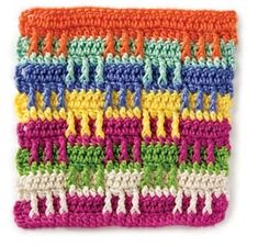 a crocheted dishcloth with many different colors and designs on it's edges