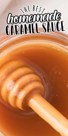 a honey jar filled with homemade caramel sauce and a wooden stick sticking out of it