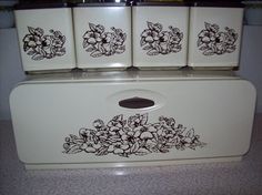 an old fashioned refrigerator with floral designs on it