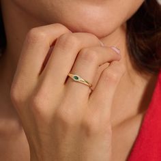 Ward off negativity with our Emerald Evil Eye Dome Ring, a symbol of protection and style. Crafted in 14k 18k 10k solid gold, this statement ring features a slim dome design adorned with a captivating emerald gemstone at its center. The evil eye motif adds a touch of mystique while offering you protection and good fortune. This ring serves as both a fashionable accessory and a meaningful symbol of safeguarding your well-being. Elevate your look and invite positivity with this exquisite piece of jewelry. Ring Details  ❥ 14k Solid Gold (also in 10k, 18k)  ❥ Gold Color Options; Yellow Gold, White Gold, Rose Gold  ❥ Band Width: 1.90 mm  ❥ Top Width: 4.35 mm  ❥ Thickness: 1.25 mm  ❥ Gemstone: AAA Grade Emerald Colored Cubic Zirconia  ❥ Ready to Ship 4-7 Business Days MORE FROM US Statement Ring Gift Bezel Setting Open Signet Ring, Gift Signet Ring With Bezel Setting, Fine Jewelry May Birthstone Signet Ring As Gift, Fine Jewelry Signet Ring As May Birthstone Gift, Fine Jewelry Signet Ring For May Birthstone Gift, Fine Jewelry Bezel Set Signet Ring Gift, Fine Jewelry Signet Ring With Bezel Setting As Gift, Green Signet Ring With Bezel Setting For Gift, Gold Signet Ring With May Birthstone