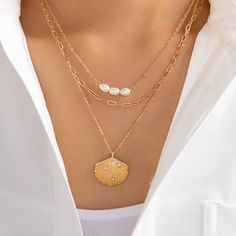 Attached layers, including everything pictured Material: gold plated brass Length: 15" + 3" extension Shell Pendant size: 0.95" x 1" IMPORTED Shell Pendant, Pearl Necklace, Shells, Gold Plate, Plating, Brass, Pendant, Gold