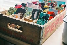 a wooden box filled with lots of cards