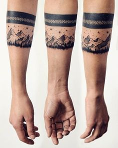 two people with matching tattoos on their arms