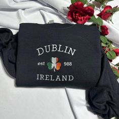 Stay warm and look stylish with this unique Dublin Ireland embroidered  at the center of the chest This piece of clothing is perfect for any casual occasion. The high-quality fabric keeps you warm and comfortable, while the intricate embroidery brings a touch of elegance and charm to any ensemble. Whether you're out and about or just lounging at home, this sweatshirt is sure to make you stand out from the crowd. The sweatshirt also features a classic crew neckline and long sleeves for a timeless Black College Sweatshirt With Embroidered Text, Black Cotton Sweater With Letter Embroidery, Gift Sweatshirt With Embroidered Text And Long Sleeves, Black Casual Sweatshirt Gift, Embroidered Logo Long Sleeve Sweatshirt, Embroidered Logo Sweatshirt As A Gift, Long Sleeve Sweatshirt With Embroidered Logo Gift, Black Embroidered Text Sweatshirt Crew Neck, Black Casual Sweatshirt With Embroidered Text