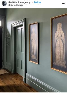 two paintings hang on the wall next to each other in a room with wood floors