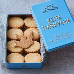 some cookies are in a blue box on a table