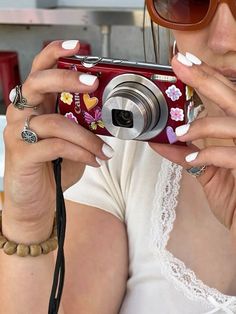 a woman taking a photo with her camera