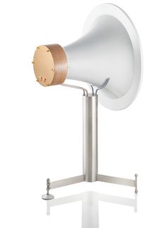 a white and wooden speaker on a metal stand