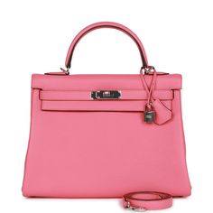 This Kelly, in the Retourne style, is in Rose Azalee clemence leather with palladium hardware and has tonal stitching, two straps with front toggle closure, clochette with lock and two keys, single rolled handle and removable shoulder strap.The interior is lined with Rose Azalee chevre and features one zip pocket with an Hermes engraved pull and two open pockets on the opposite side.Collection: YOrigin: FranceCondition: New and never worn (Plastic on hardware)Accompanied by: Hermes box, Hermes dustbag, clochette, lock, two keys, shoulder strap, clochette dustbag, shoulder strap dustbag, carebook and feltMeasurements: 12.75" width x 9" height x 4.75" depth; 3.5" handle drop (16.5" shoulder strap drop) Book Closet, Hermes Kelly Retourne, Hermes Box, Hermes Bags, Zip Pockets, Dust Bag, Shoulder Strap, Fendi, Dior