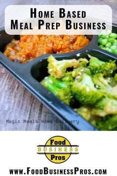 a black tray with broccoli and other food in it on top of a wooden table