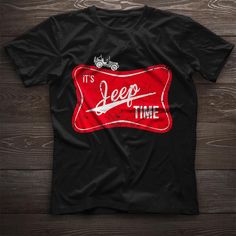 a black t - shirt with the words it's jeep time on it