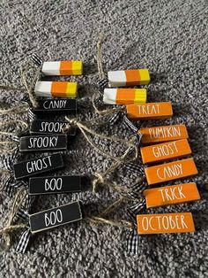 candy bar name tags are arranged on the carpet with twine and rope around them