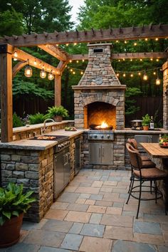 an outdoor kitchen is lit up with lights