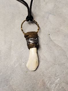 Very nice Buffalo Bison tooth pendant. Wrapped in polymer clay and a bronze ring to hang it from. Measures 2 1/2" long x 1/2" wide Buffalo Bison, Tooth Pendant, Thick Necklace, Alternative Jewelry, Bronze Ring, Gold Chain Necklace, Pearl Pendant, Gift Necklace, Pendant Necklaces