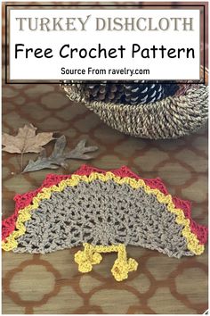 a crocheted turkey dishcloth on a table