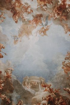 an ornate painting on the ceiling of a building