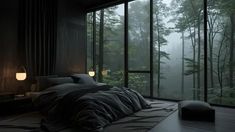 a bed sitting in a bedroom next to a window filled with lots of dark colored furniture