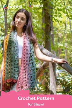 a woman wearing a crochet shawl in the woods with text overlay that reads, crochet pattern for shawl