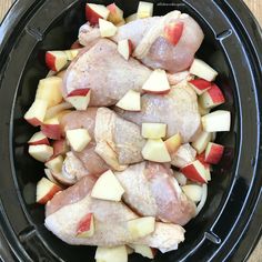 chicken, apples and potatoes are in an air fryer to make the best slow cooker meal