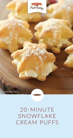 a wooden plate topped with mini snowflake cream puffs