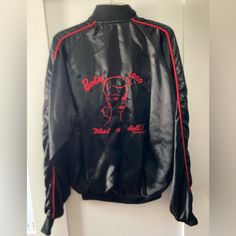 Barbie “Nostalgic” Collector Jacket From 1988, Brand New. Black With Red Pin Striping On Sleeves, And Red Lining. Two Front Pockets, And The Jacket Is Zippered. There Is A Nostalgic Barbie Design On The Front And A Design On The Back: Barbie 1959, What A Doll! Jacket Is Made By Rock Shop Clothing Co. In 1988, 100% Nylon, Except For Collar And The Bottoms Of The Sleeves. Label Says M (Medium). This Is An Adult Size Jacket. This Is A Very Rare Jacket And Brand New, Never Worn. I Think The Jacket M Black Graphic Print Outerwear For Work, Vintage Black Long Sleeve Track Jacket, Retro Fitted Track Jacket For Streetwear, Fitted Retro Track Jacket For Streetwear, Retro Black Outerwear With Graphic Print, Black Vintage Track Jacket For Fall, Retro Black Track Jacket For Streetwear, Barbie Design, Barbie Convention