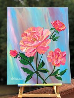 an acrylic painting of pink flowers on a blue background