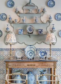 blue and white china is on display in the dining room