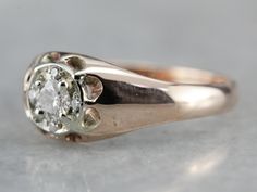 We've created this handsome ring which is well proportioned, with plenty of sparkles, but not a strain on the budget. The bright round brilliant cut diamond gleams from the center of a round halo of white gold Retro Era head in the Illusion style, while the antique rose gold shoulders are polished to perfection! Metal: 10K Antique Rose Gold, 14K White Gold Gem: 5 Diamonds totaling .24 Carats, G in Color, SI1 in Clarity Gem Measurements: 3.6 mm, Round (Center Stone) Ring Size: 7.25 SKU #: 7HUW5M2 Heirloom Single Diamond Round Cut Ring, Heirloom Round Cut Single Diamond Ring, Heirloom Diamond Ring With Brilliant Cut, Heirloom Diamond Ring With Brilliant Round Cut, Heirloom Rose Gold Diamond Ring With Single Diamond, Heirloom Brilliant Cut Round Diamond Ring, Dazzling Single Diamond Round Ring, Anniversary Diamond Ring With Single Round Stone, Formal Domed Diamond Ring With Brilliant Cut