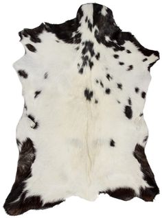 a black and white cowhide rug on a white background