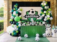 a soccer themed birthday party with balloons and decorations