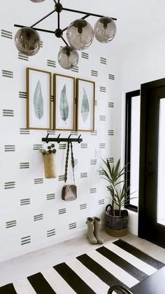 a white room with black and white stripes on the wall