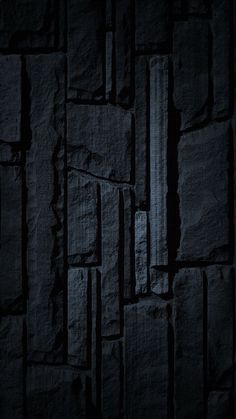 a black stone wallpaper with vertical lines