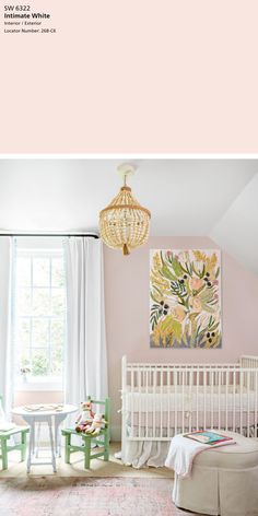 a baby's room with pink walls and white furniture