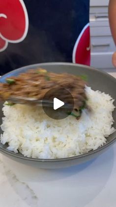 a plate with rice and meat on it