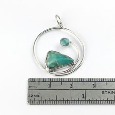 "This pendant features a free form natural Peruvian opal and a round blue apatite in a wave of sterling silver. The stones in this pendants are so unique and one of a kind, the one photographed is the one you will receive. Approximately 1\" inch with a 6mm (1/4\" inch) pendant bale. The Peruvian opal is 13mm and 5mm apatite. Made of sterling silver. If you would like this pendant as a necklace, you can purchase it with a necklace chain: https://www.etsy.com/listing/238444130/necklace-chains-for- Unique Spiral Turquoise Jewelry, Sterling Silver Jewelry With Natural Stones In Freeform, Sterling Silver Jewelry With Natural Stones In Unique Shapes, Sterling Silver Jewelry With Natural Stones, Apatite Round Beads For Jewelry Making, Minimalist Silver Ring, Peruvian Opal, Silver Stacking Rings, Blue Apatite