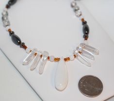 White Jade drop and accents with Quartz Crystal Shards, Tourmalated Quartz, Magnetic Hematite, and honey colored glass seed bead Tribal style necklace.  19 inches long with a gunmetal lobster clasp. Arrives gift boxed with a jewelry pouch. https://www.etsy.com/shop/shimmershimmer White Crystal Necklace, Jade Magnetic Hematite Quartz Necklace, Tribal Style Jewelry, Gift for Man or Woman Unisex Jewelry, Shimmer Shimmer #574 Quality craftsmanship that is top notch with over 20 years in professional Crystal Shard, White Crystal Necklace, Tourmalated Quartz, Jade Crystal, Quartz Crystal Necklace, Professional Jewelry, White Jade, White Necklace, Original Jewelry