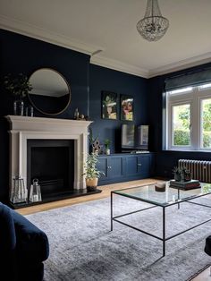 a living room filled with furniture and a fire place