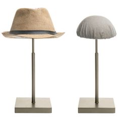 Featuring a domed top and metal construction, this set of 2 hat display riser stands are an excellent way to keep your hats accessible and add a touch of rugged decorative accent to your home or retail setting. Its small footprint can keep conveniently stored on a dresser, table, or counter top surface. The fabric dome top can protect the hat or helmet lining and help preserve hat's proper structure to maintain the appearance. The minimalist bronze metal construction nicely complements a wide ra Wide Coat, Entryway Rack, Hat Holder, Hat Display, Hair Accessories Set, Wig Stand, Hat Rack, Hat Stands, Hair Decorations