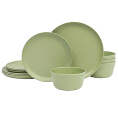 the green dishes are stacked on top of each other, with one bowl and two plates