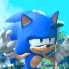 sonic the hedgehog from mario kart is pointing at something in front of him