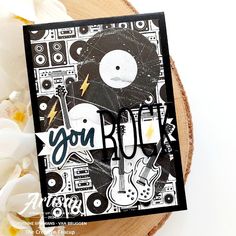 a card with an image of a guitar and the words you rock on it