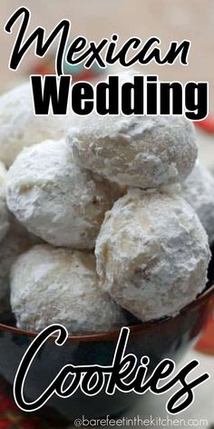 mexican wedding cookies in a bowl on a table