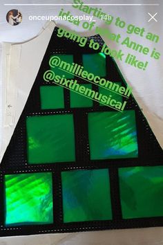 a triangle shaped cake with green frosting on it's top and the words, something to get an idea of what anne is going to look like